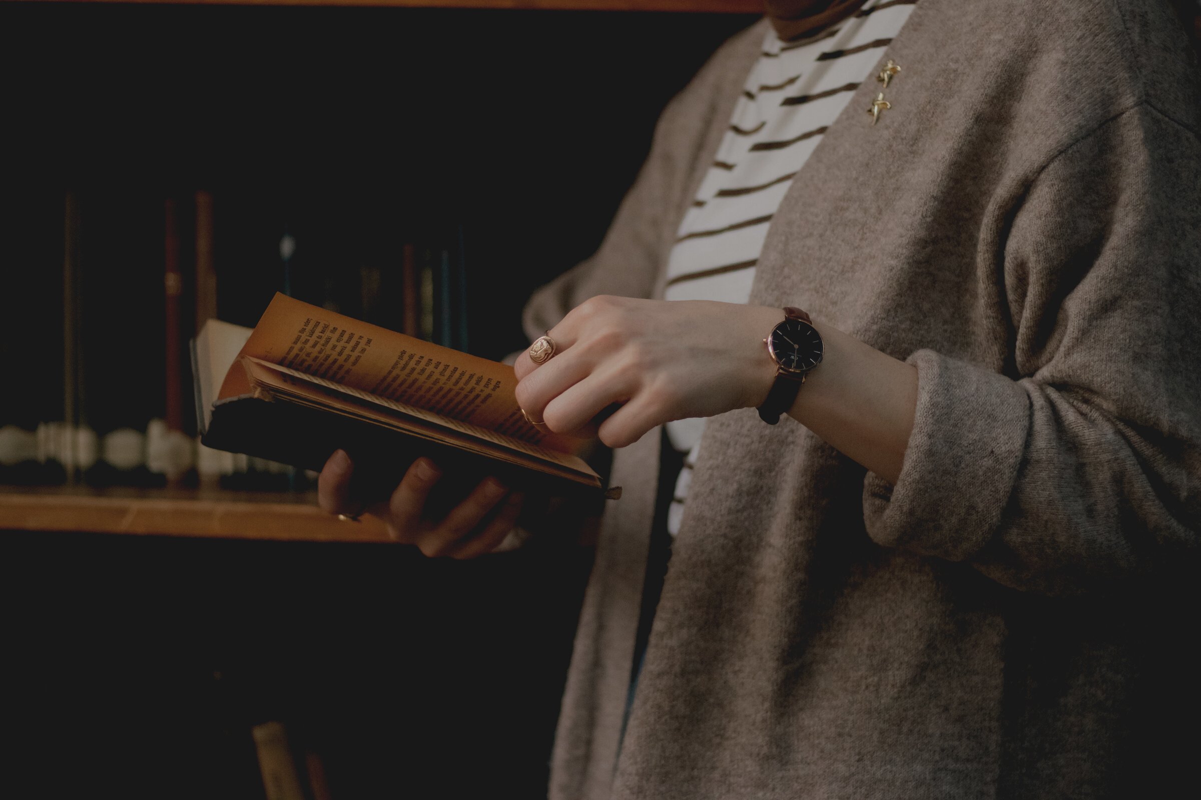 Student Reading Book in Library